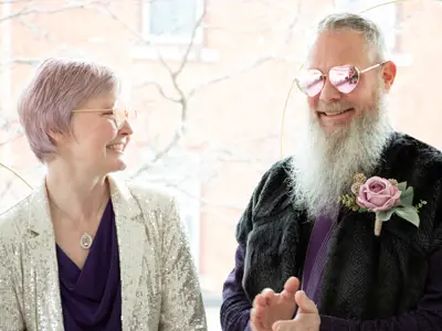 Man and woman in heart-shaped glasses