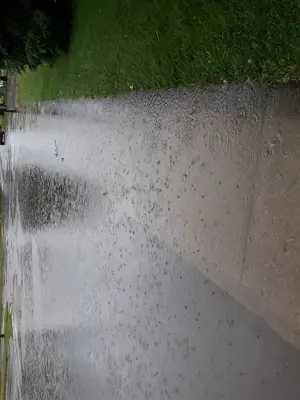 Large puddles on road in rain