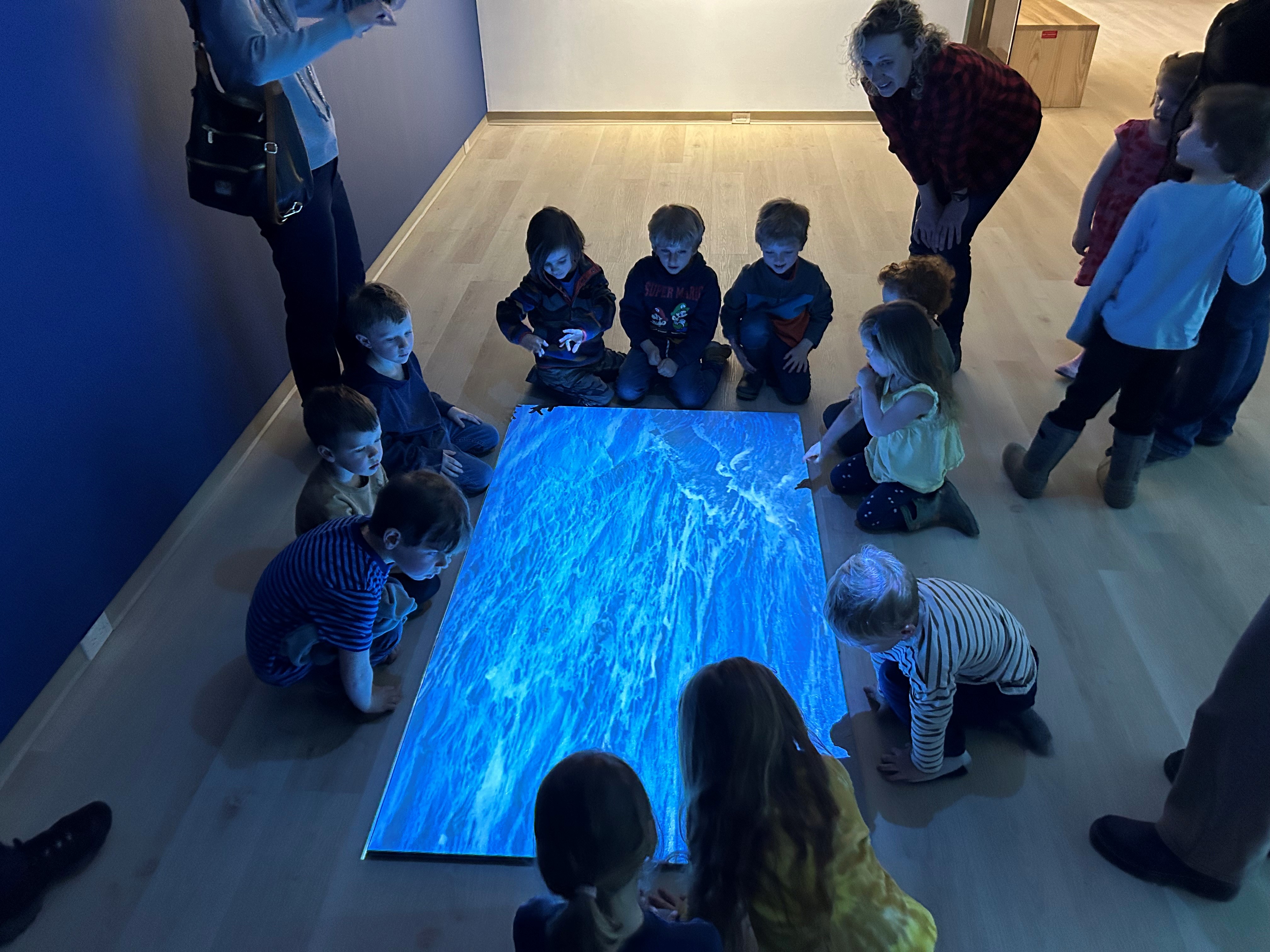 Children interacting with digital art